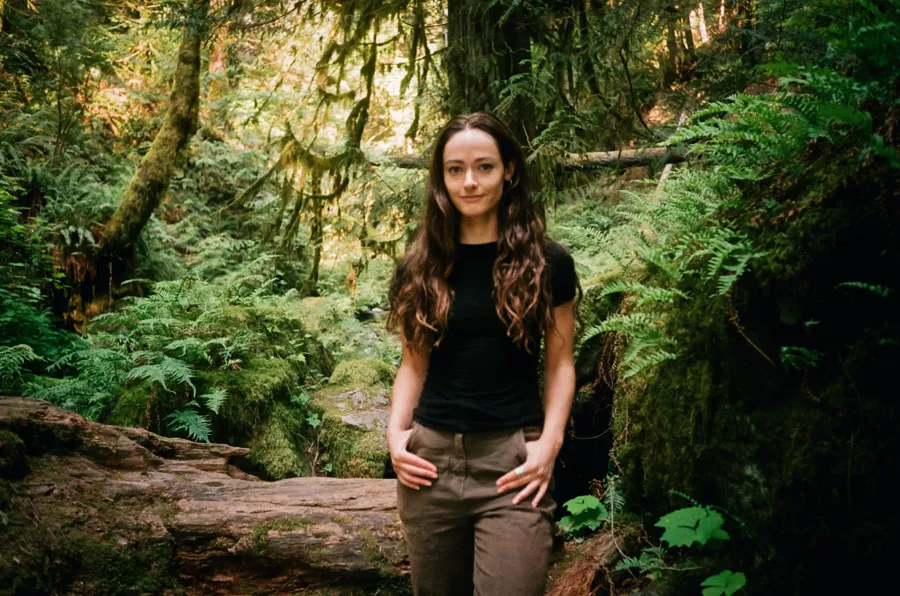 Maia Wikler in a mossy rainforest